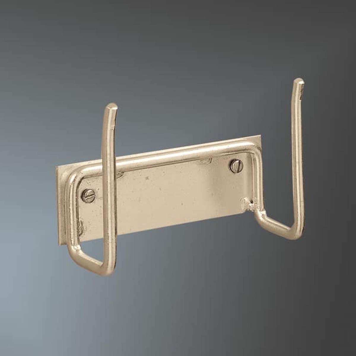 American Metalcraft WPH45153 brass-finish wall-mounted pizza peel holder with two U-shaped wire hooks and rectangular mounting plate