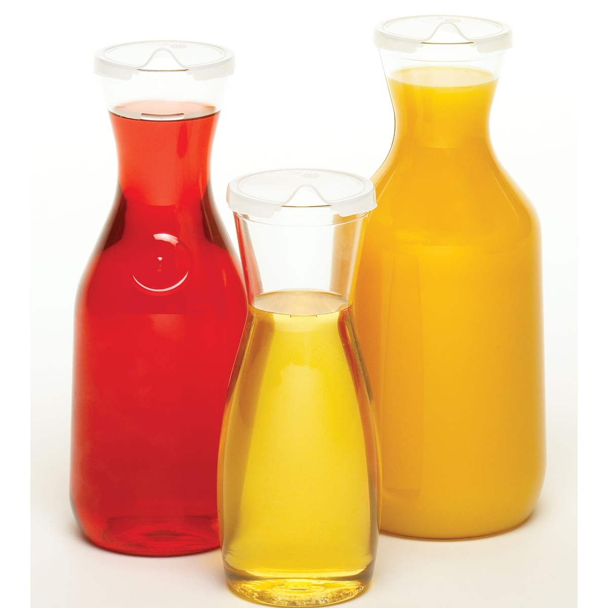 Three Cambro CamView Camliter decanters in different sizes filled with red, golden, and orange beverages with lids