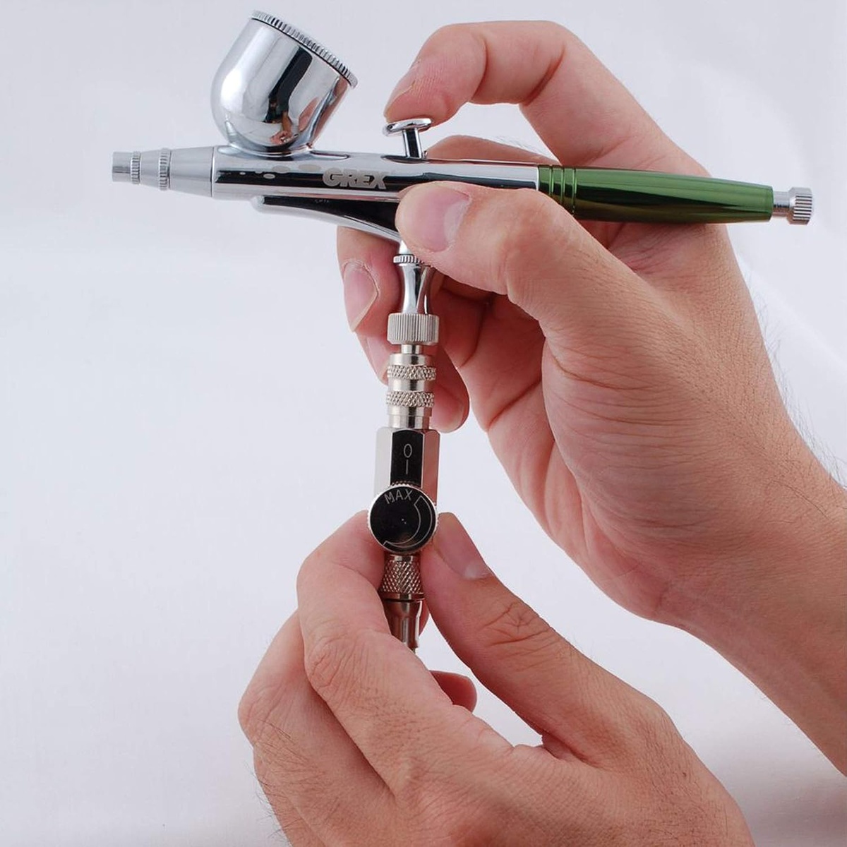 Grex G-MAC MAC Valve w/ Quick Connect Coupler & Plug installed on an airbrush for real-time airflow adjustment during detail painting