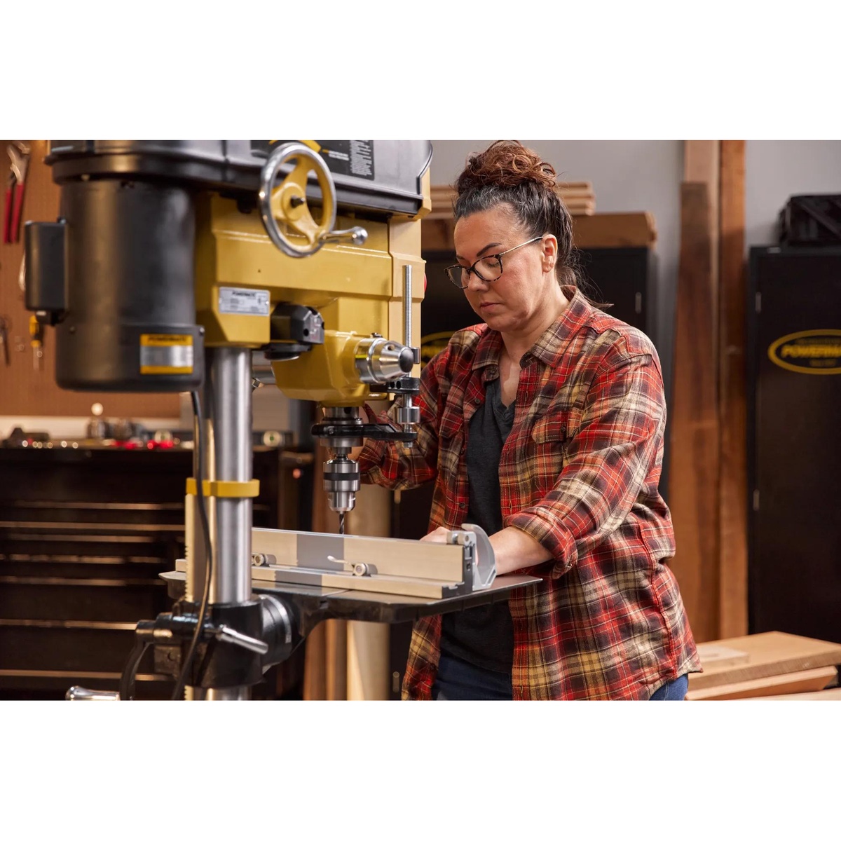 Powermatic 1792800B PM2800B Drill Press, 1HP 1PH 115/230V set up for precision drilling on a shop workpiece with fence support in a woodworking environment