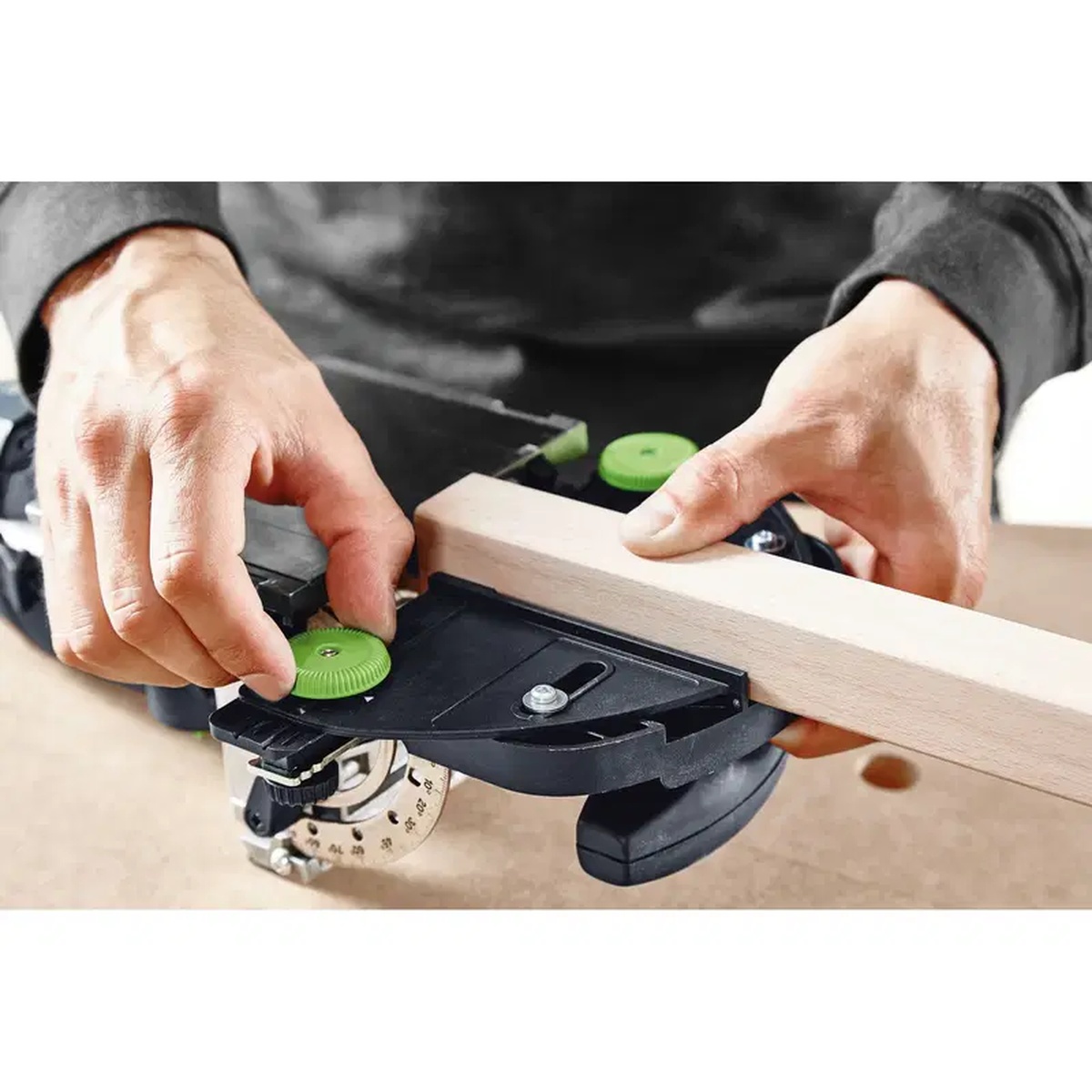Festool 493487 Domino Trim Stop guiding a Festool DOMINO joiner on a narrow wood rail for repeatable mortise placement in woodworking