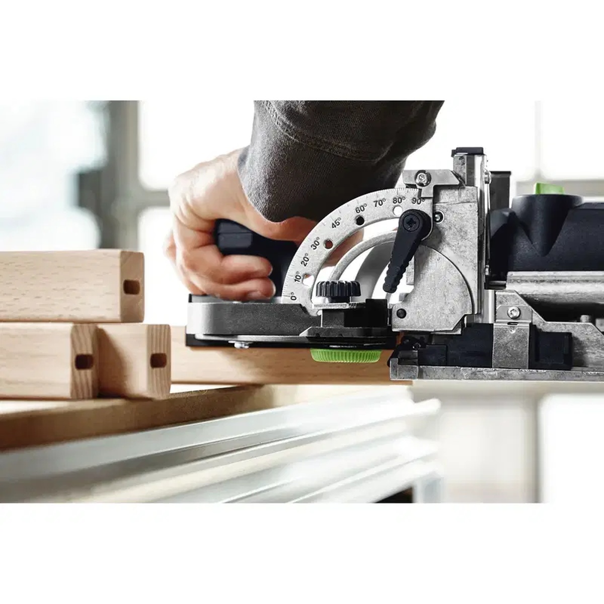 Festool 493487 Domino Trim Stop installed on a Festool DF 500 or DF 700 joiner while cutting mortises in narrow wood components at the bench