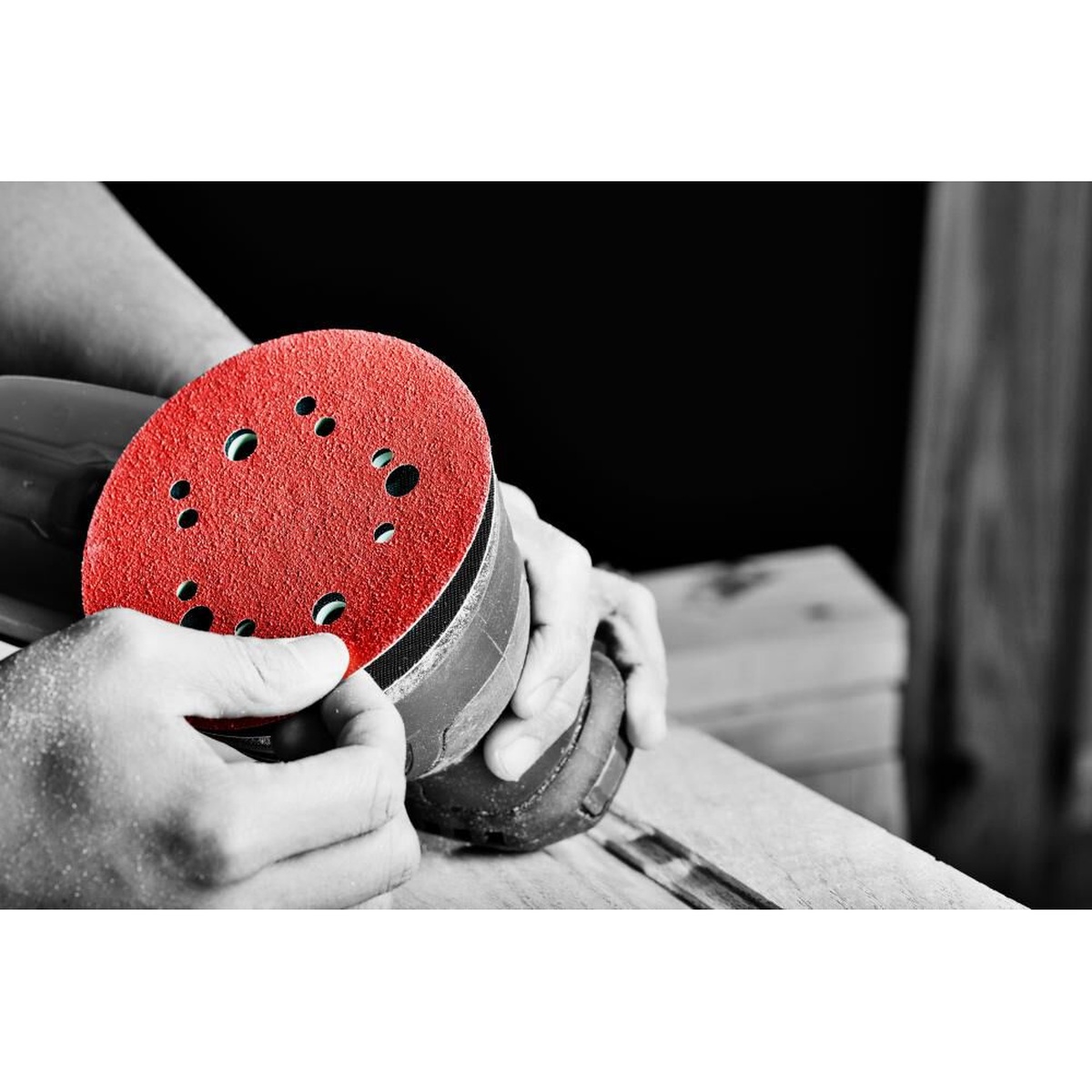 Diablo DCD050VFNH07G 5 inch hook and loop sanding disc being attached to a random orbital sander on a woodworking bench