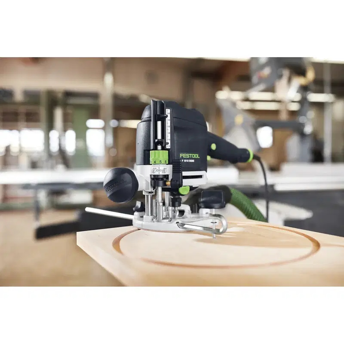 Festool 483922 Trammel Unit OF 1010 mounted on a Festool OF 1010 router routing a circle in a wood panel