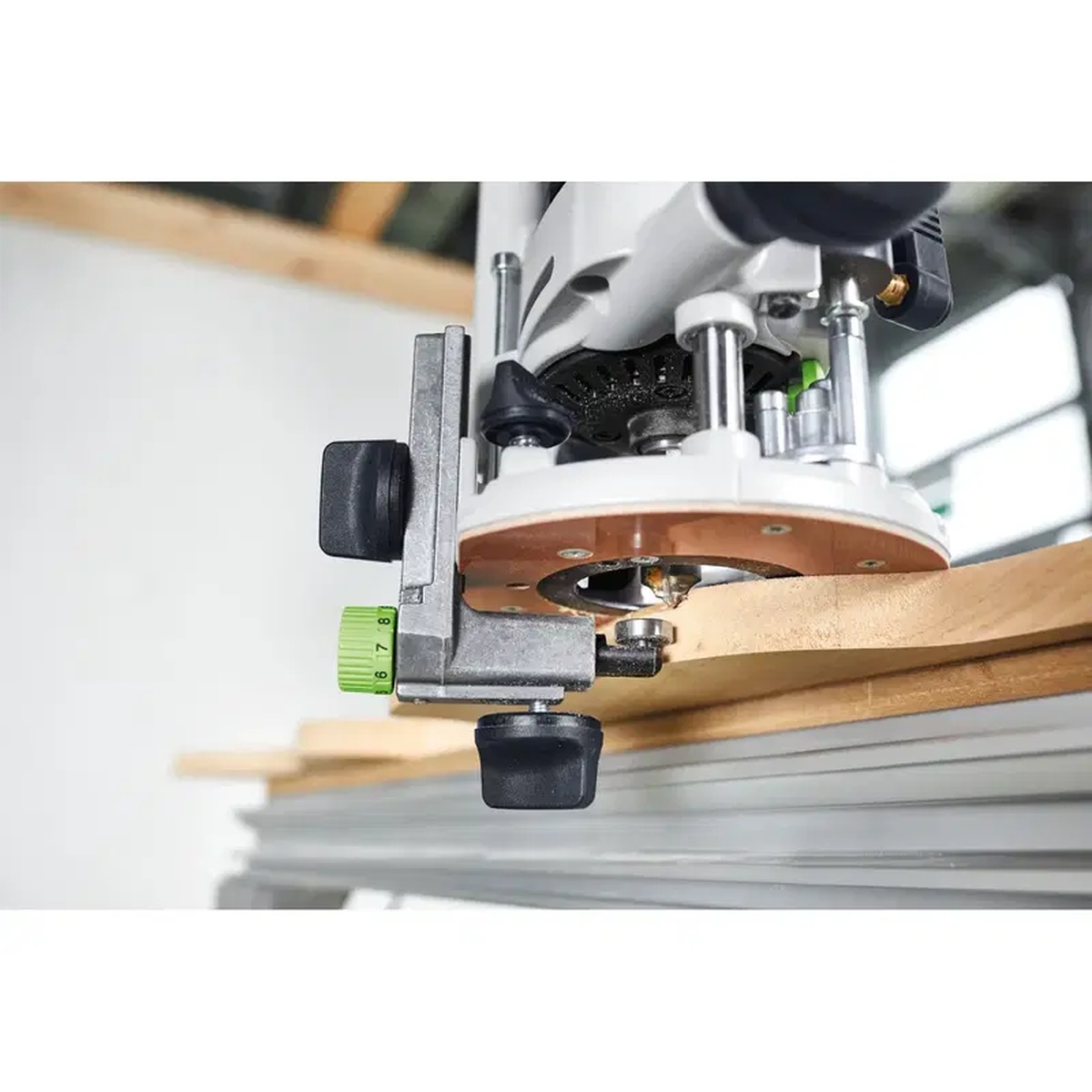 Festool 486052 Angle Arm installed on a Festool router for flush trimming a wood edge in a workshop setup