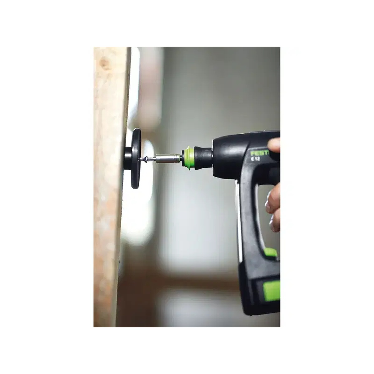 Festool 499814 SysLite Magnetic Mount Head fastened on wood framing with a drill for flexible light mounting in remodeling work