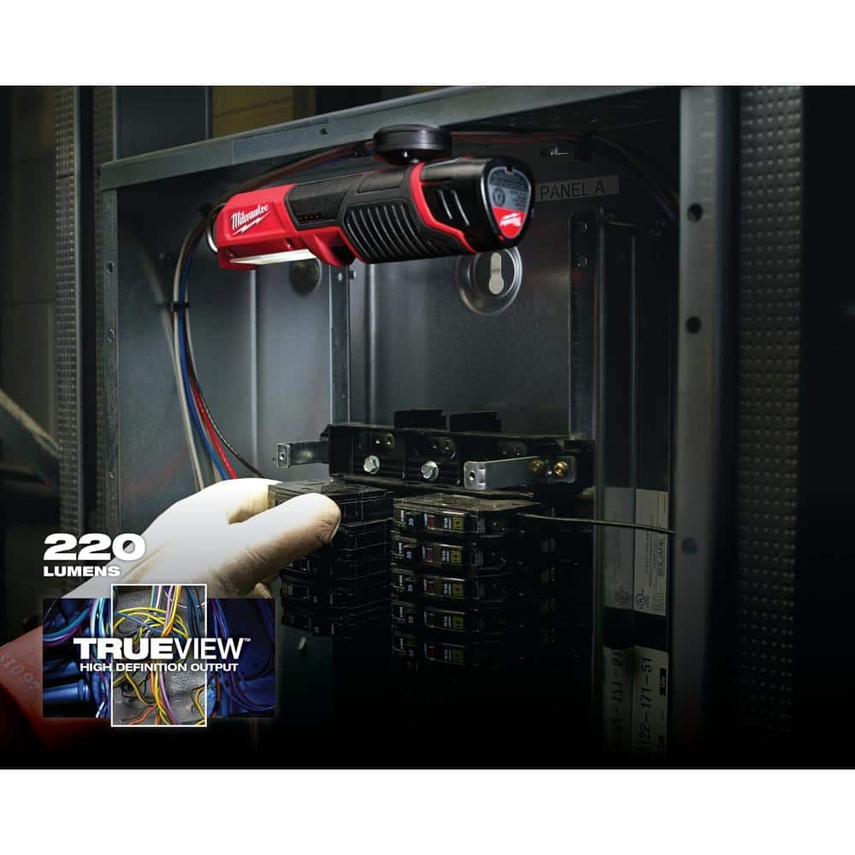 Milwaukee 2351-20 M12 LED Stick Light illuminating an electrical panel during service work for close-range inspection lighting