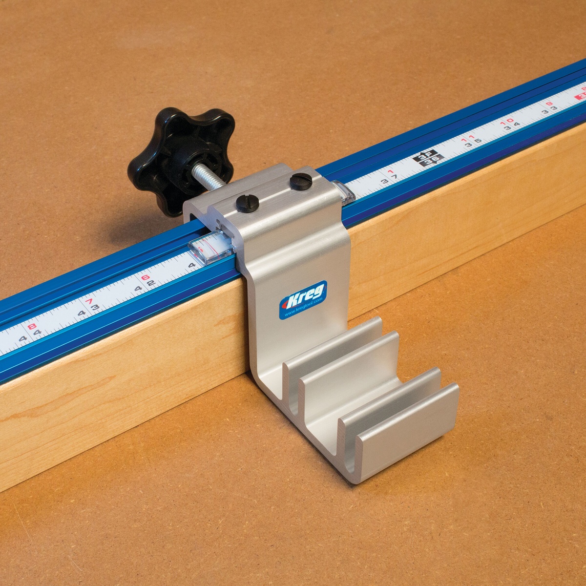 Kreg KMS7800 Production Stop mounted in Kreg track with dual lens cursor aligned to measuring scale on a woodworking fence