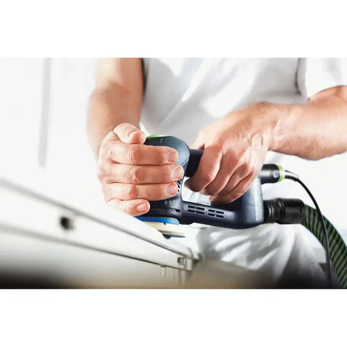 Festool 495623 3-1/2 in. Hard Pad for RO 90 installed on an RO 90 DX while sanding a painted panel edge in finish work