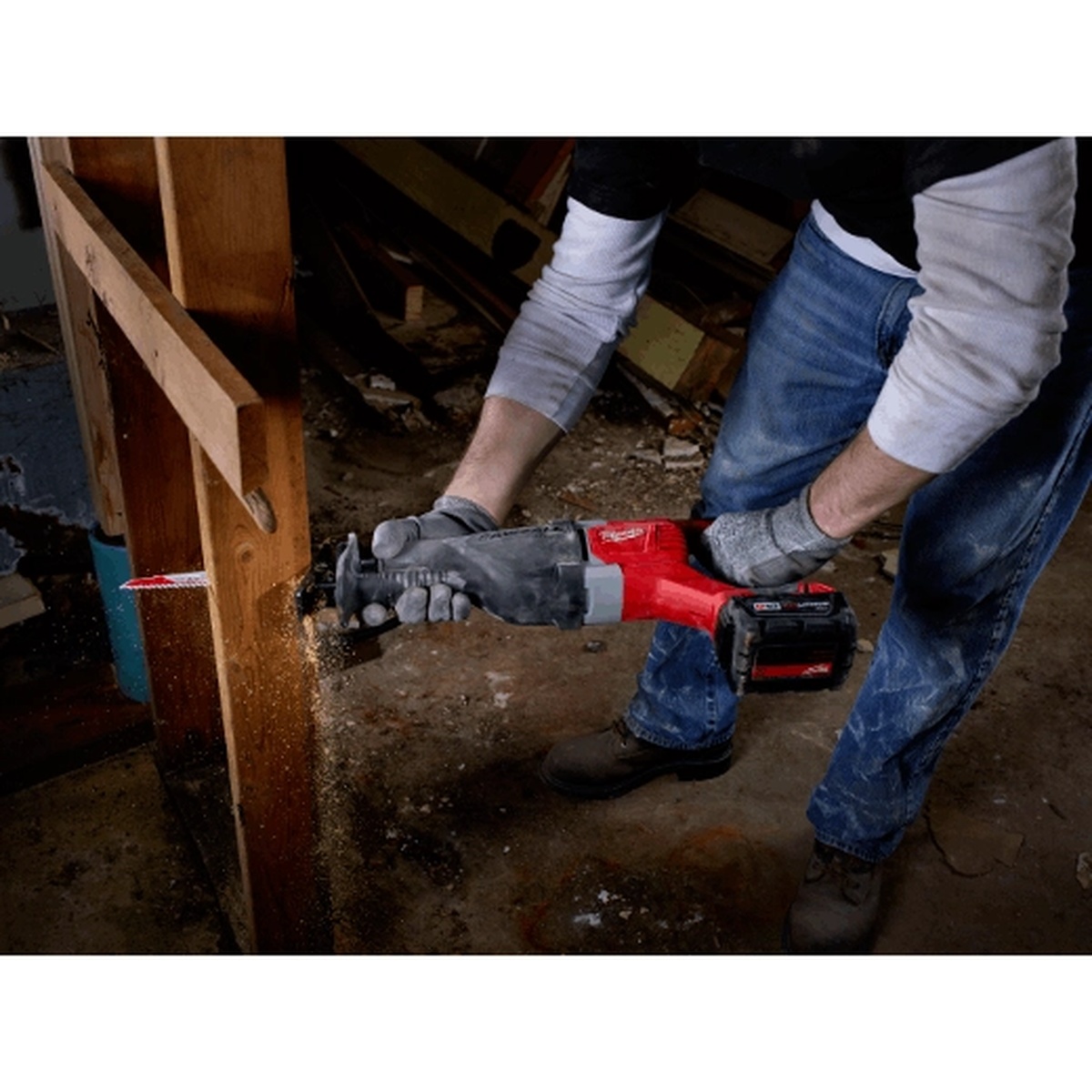 Milwaukee M18 SAWZALL Reciprocating Saw cutting through wood framing during interior demolition work