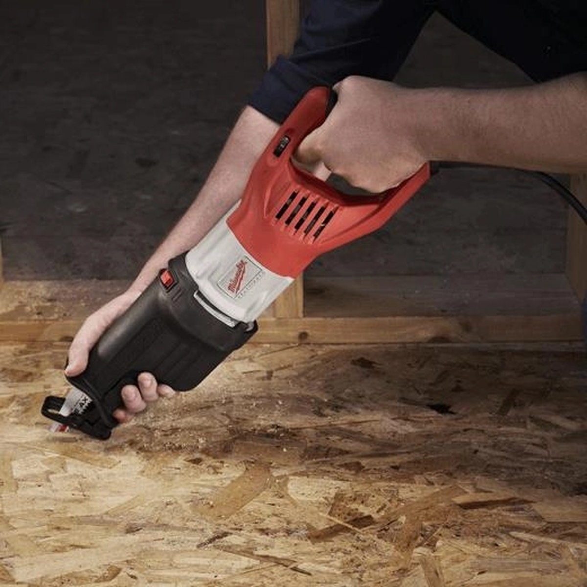 Milwaukee 6538-21 15.0 Amp Super Sawzall Reciprocating Saw used low to the floor during wood demolition on a jobsite