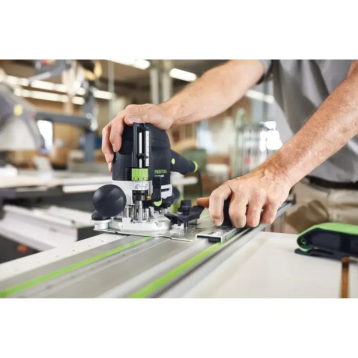 Festool router using a dowel drill router bit on a guided woodworking setup for accurate repeat hole placement