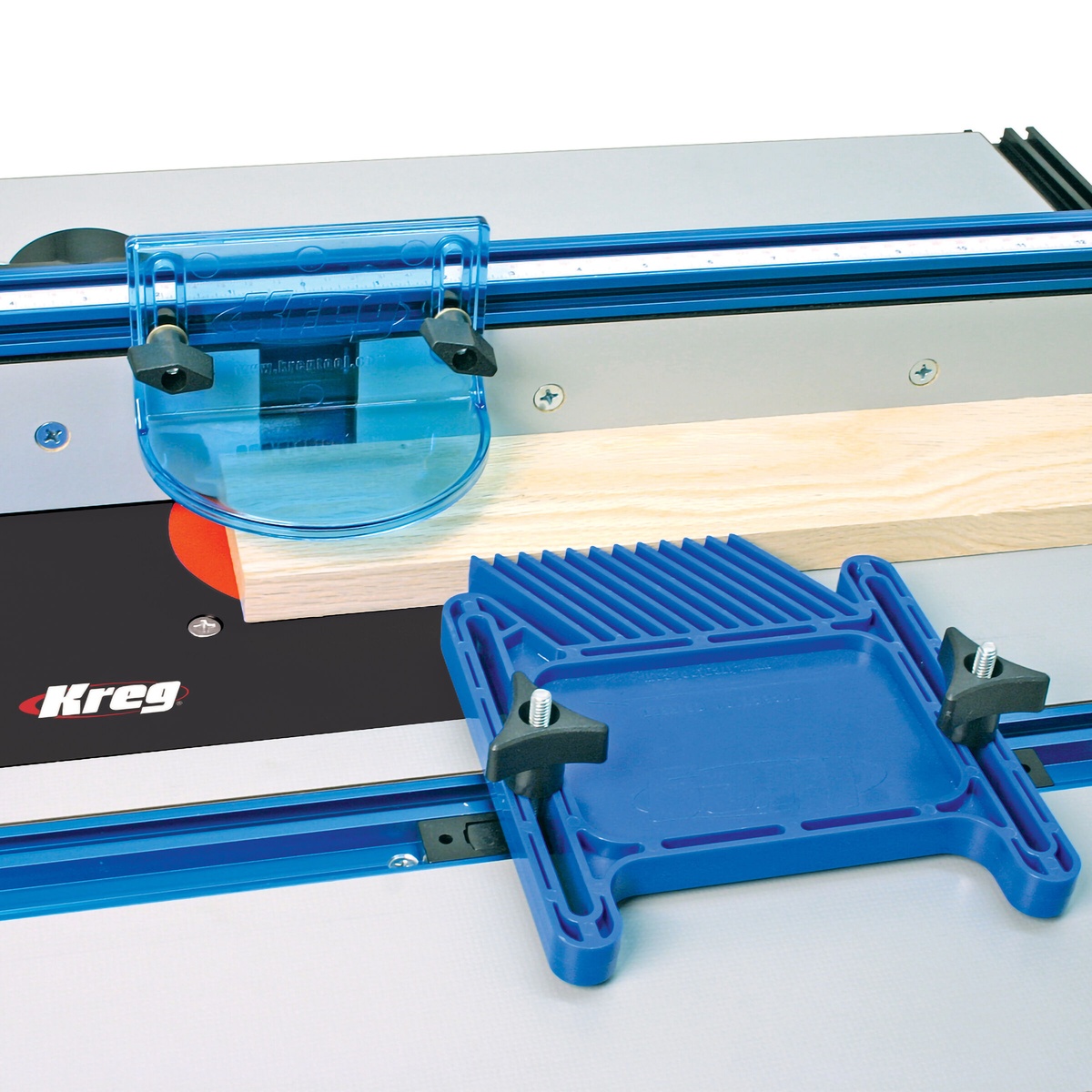Kreg PRS3010 True-FLEX Featherboard - Single positioned on a router table beside a wood board during routing setup in a workshop