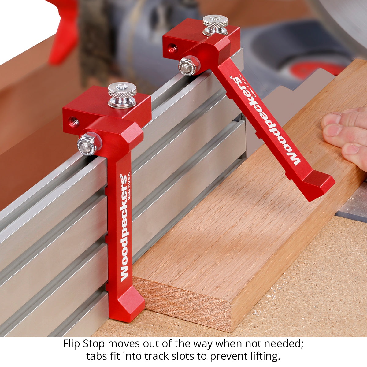Woodpeckers STFSTOP Super Track Flip Stop on an aluminum track fence stopping a hardwood board during cut setup at a miter saw station