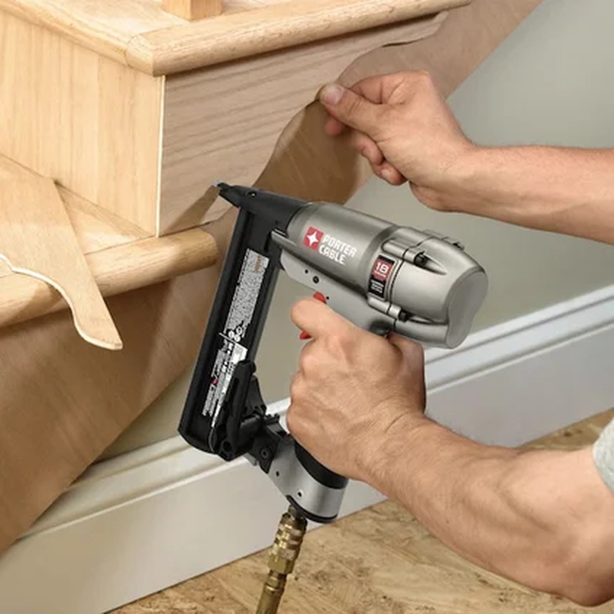 Porter Cable NS150C Pneumatic 18-Gauge 1-1/2 in. Narrow Crown Stapler Kit attaching trim and wood components during finish carpentry work