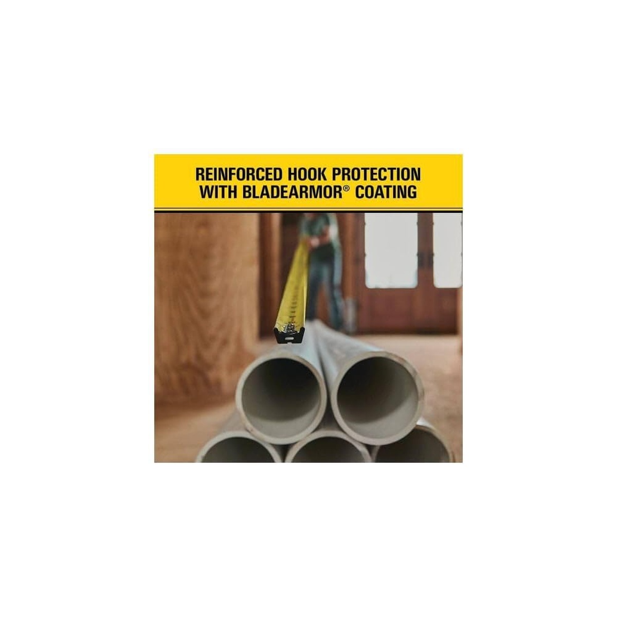 Stanley FATMAX tape blade hooked onto pipe during measuring work with reinforced hook protection and coated blade