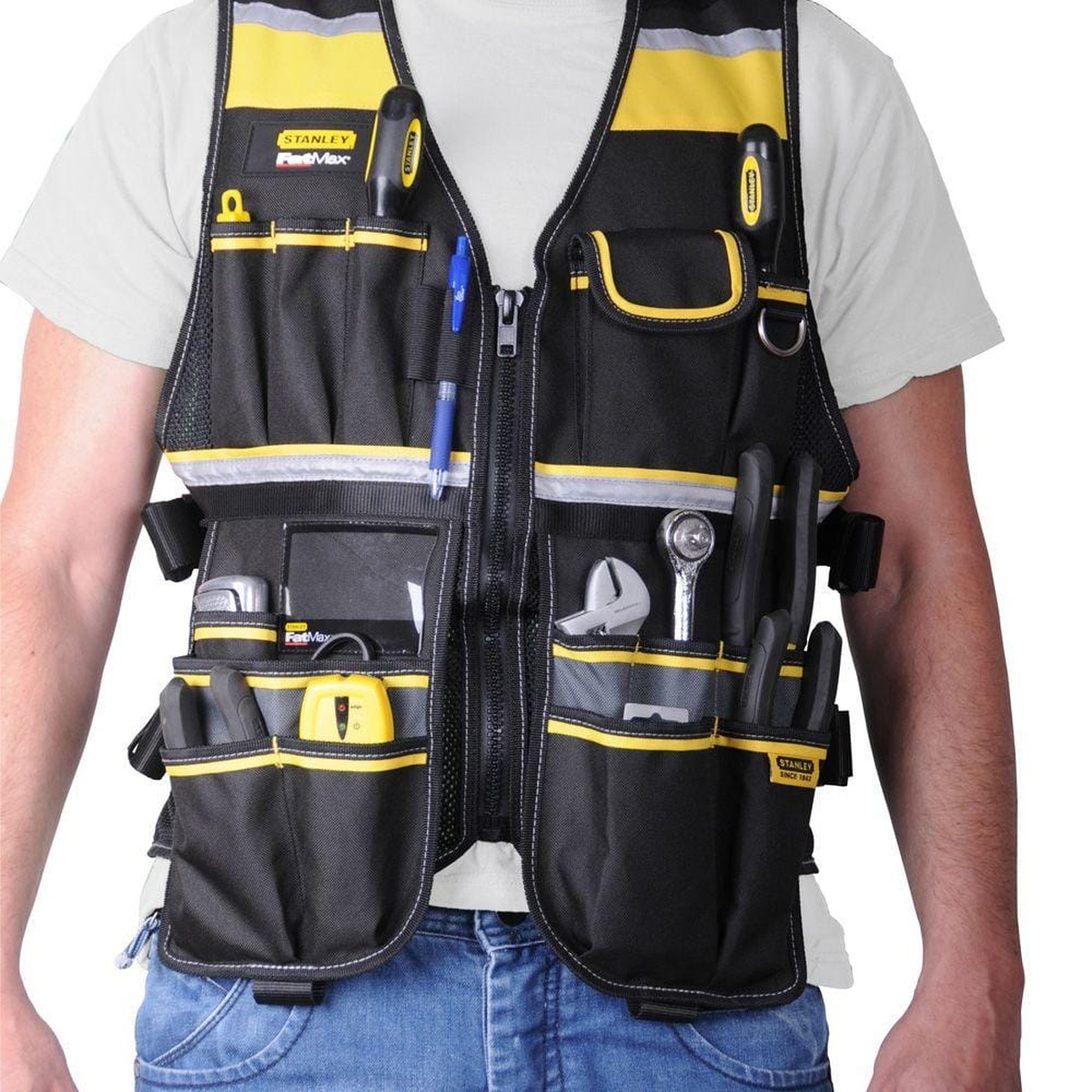 Stanley FMST530201 FatMax Tool Vest worn over work clothes during indoor construction and tool carrying