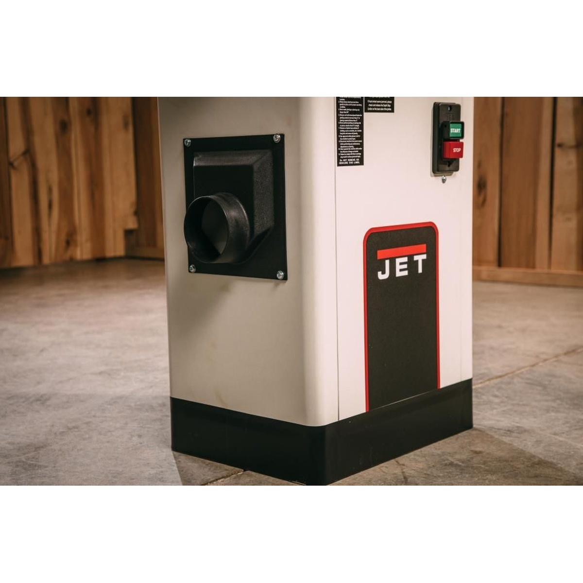 Jet JJ-6CSDX jointer closed steel stand with 4 inch dust port and push-button controls in a woodworking shop for chip collection and stationary milling