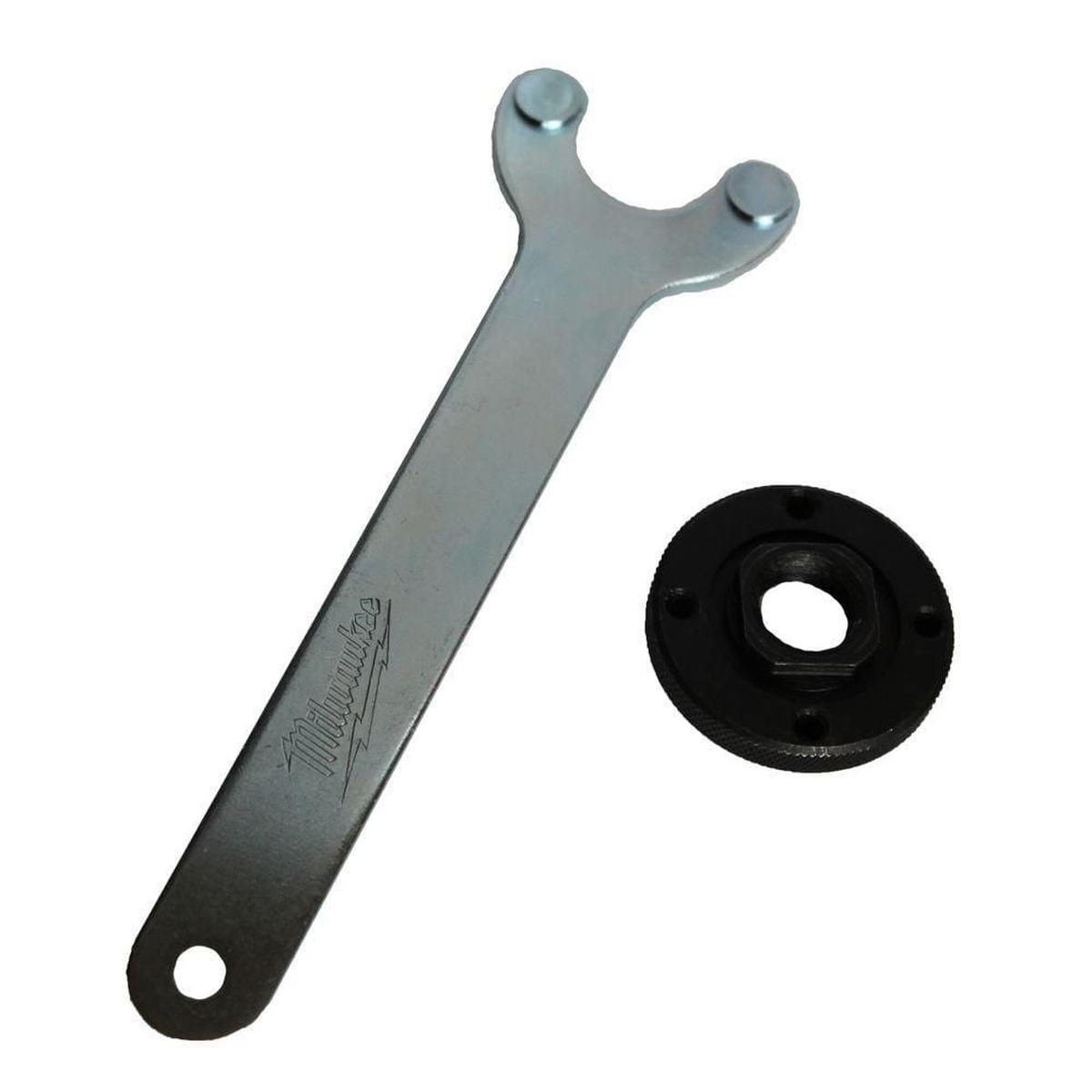 Milwaukee 48-03-1050 Grinder Flange Nut Kit with flange nut and wrench for small angle grinder accessory changes in a shop or jobsite maintenance setup