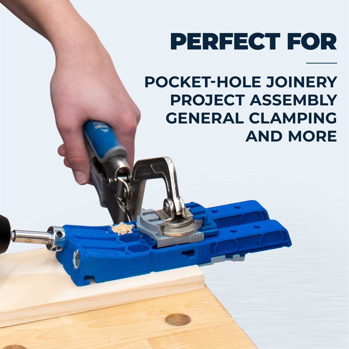 Kreg KHC3 3 inch Wood Project Clamp used with a Kreg pocket-hole jig on a woodworking bench during cabinet and project assembly