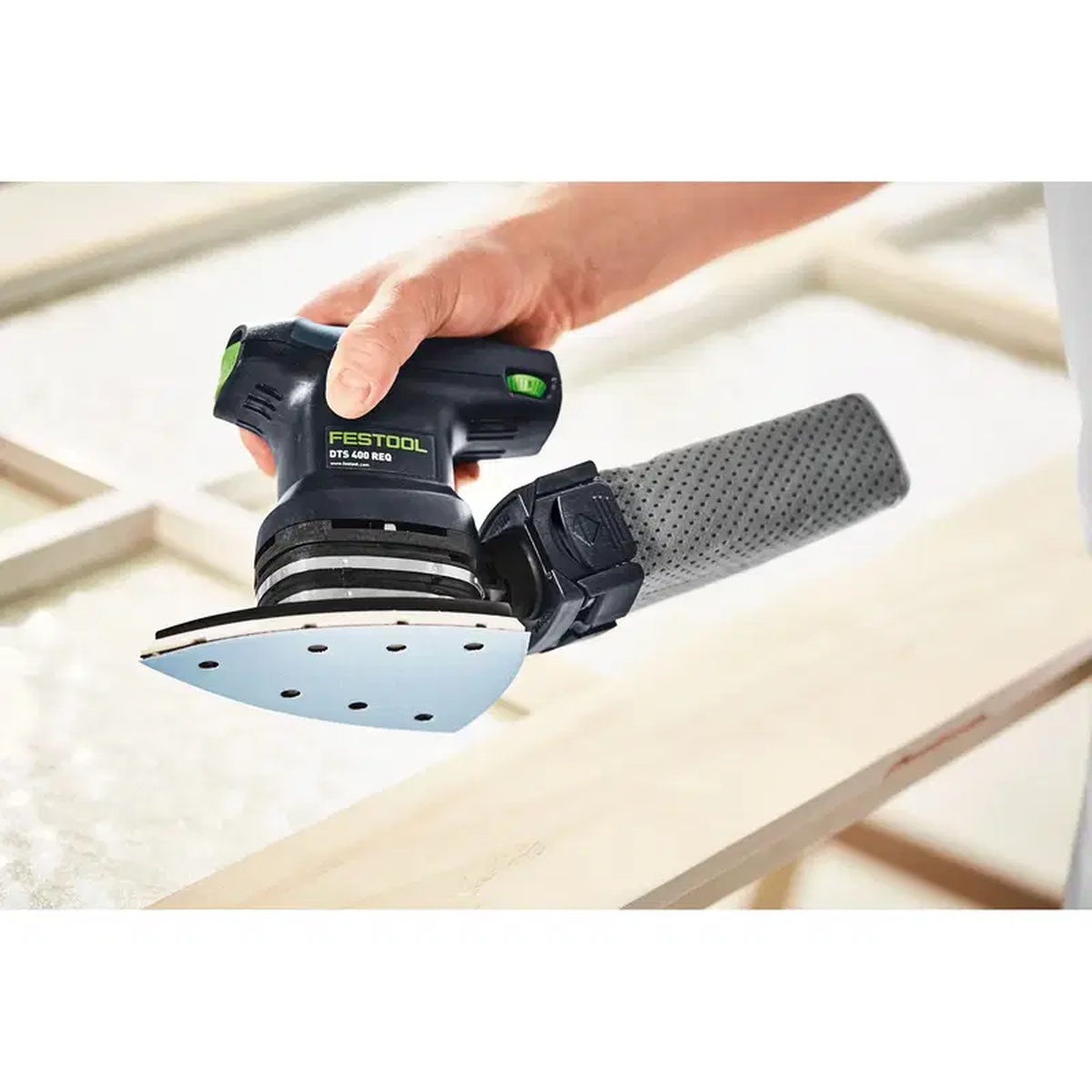 Festool 201693 Long Life Reusable Sander Dust Bag attached to a Festool detail sander during finish sanding on wood in a workshop setting
