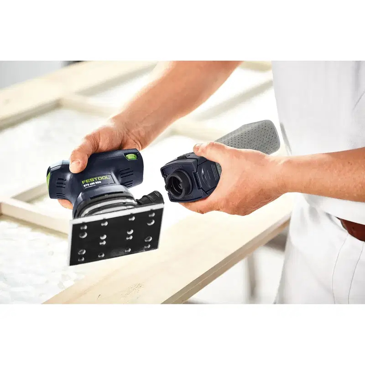 Festool 201693 Long Life Reusable Sander Dust Bag being installed on a Festool rectangular sander for dust collection during finish work