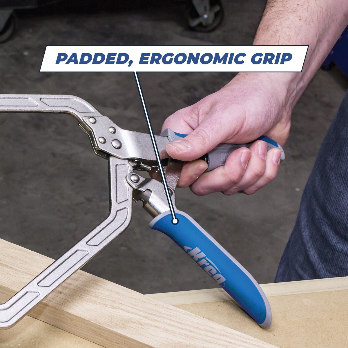 Kreg KHCRA Automaxx Right Angle Clamp being squeezed by hand during woodworking assembly on a bench for pocket-hole fastening