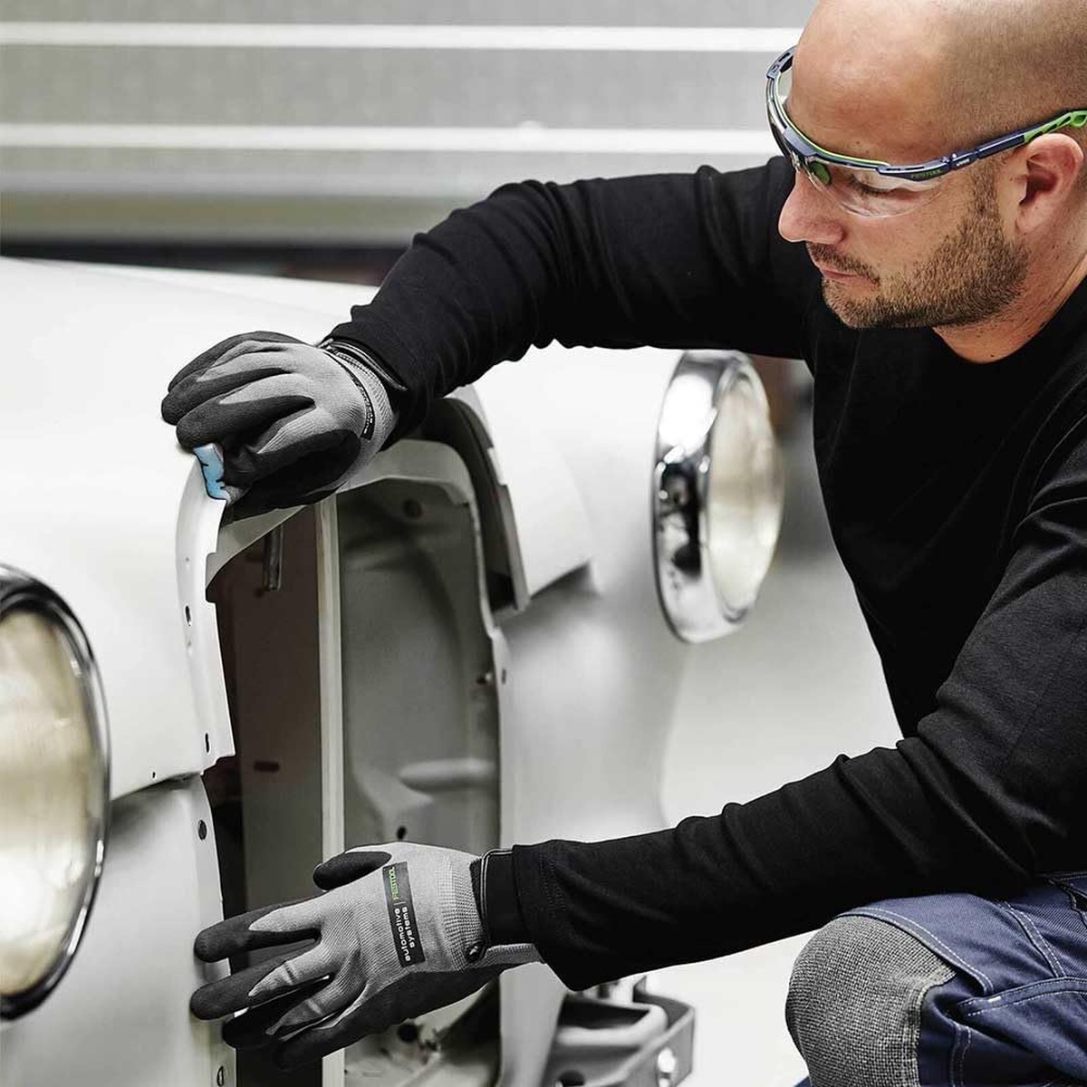 Festool abrasive sponge used during automotive repair sanding on a vehicle body edge and inner panel opening