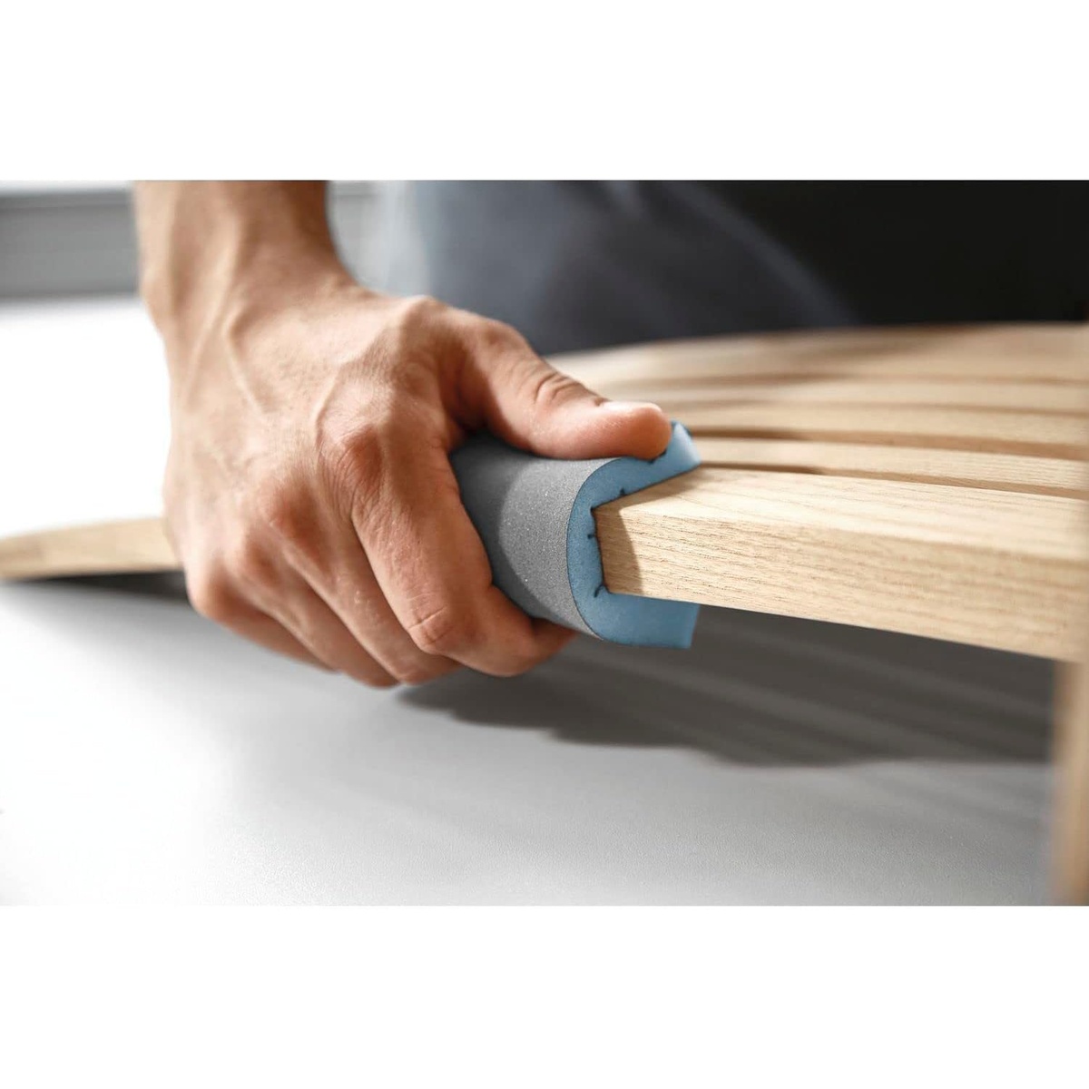Festool 201507 Granat Abrasive Sponge, 800 Grit, 6-Pack sanding a shaped wood edge during fine finish sanding in a woodworking shop