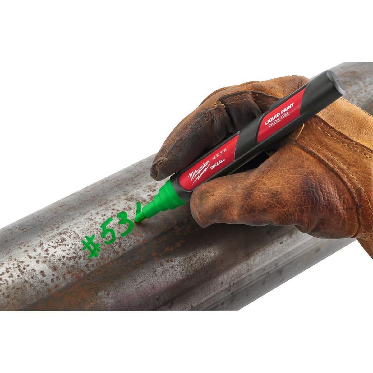 Milwaukee 48-22-3751 INKZALL Green Paint Marker marking rough metal pipe on a jobsite for layout and identification
