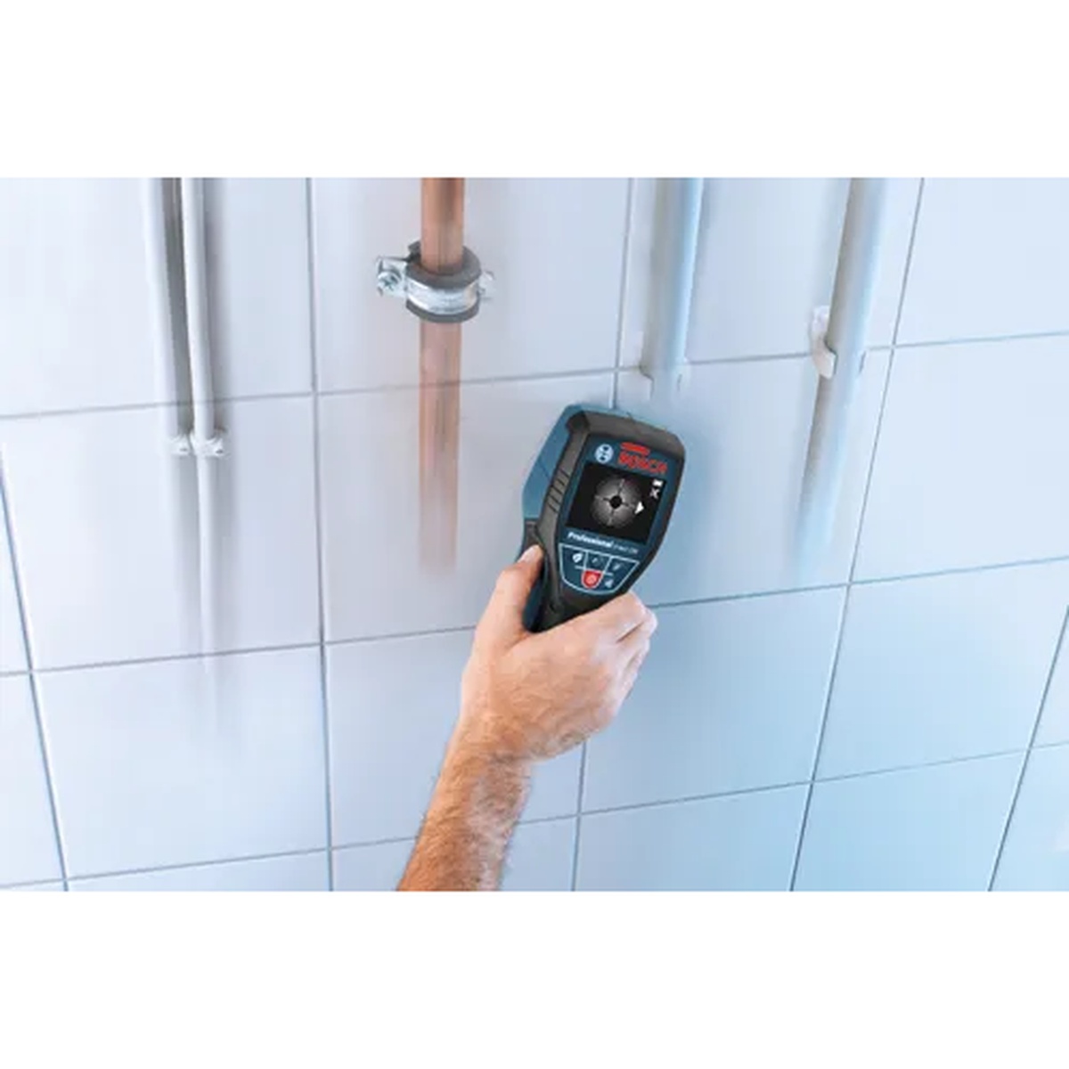 Bosch D-Tect 120 Wall/Floor Scanner locating hidden pipe behind a tiled wall during plumbing and renovation work
