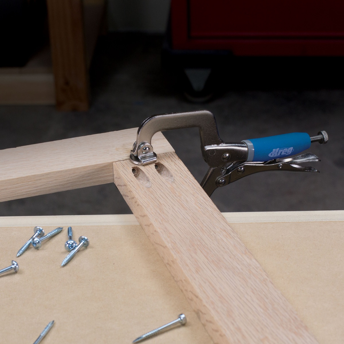 Kreg Tool KHC-MICRO Classic 2 inch Face Clamp holding two wood pieces flush during pocket-hole assembly on a woodworking bench