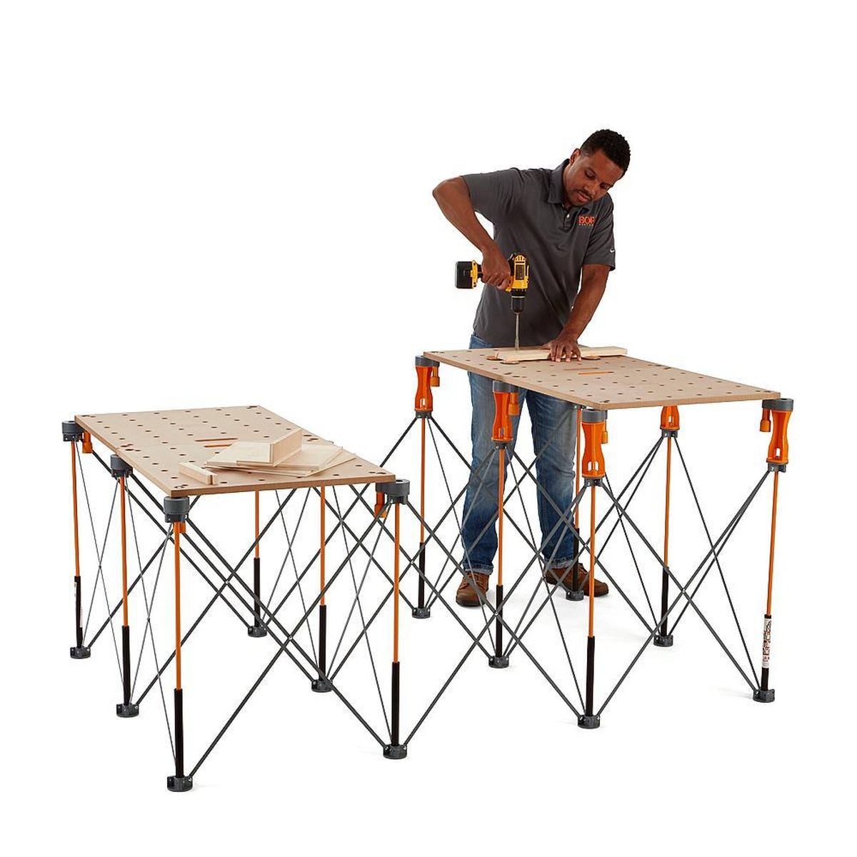 Bora CK12S Centipede Work Support Sawhorse set up as a portable workstation for drilling and bench work with sheet material in a workshop setting