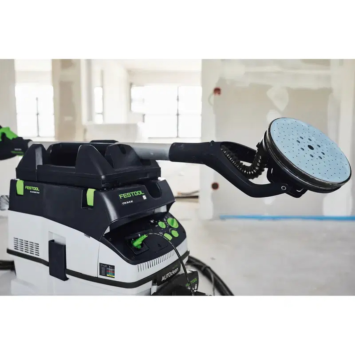 Festool 205274 Planex Sander CT Dust Extractor Tool Holder supporting a PLANEX long-reach sander on a CT dust extractor during interior drywall finishing work