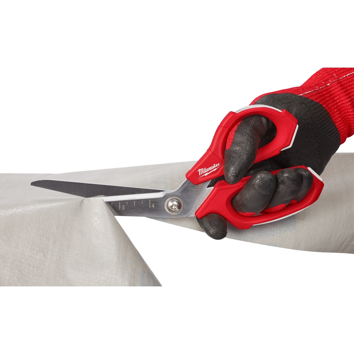 Milwaukee 48-22-4047 Jobsite Offset Scissors trimming sheet material with gloved hand on a jobsite