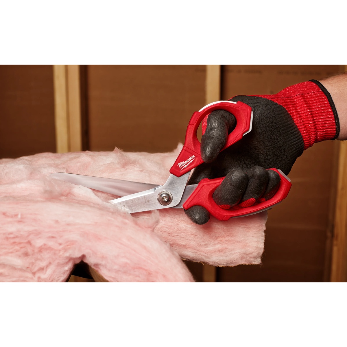 Milwaukee 48-22-4047 Jobsite Offset Scissors cutting fiberglass insulation during remodeling work