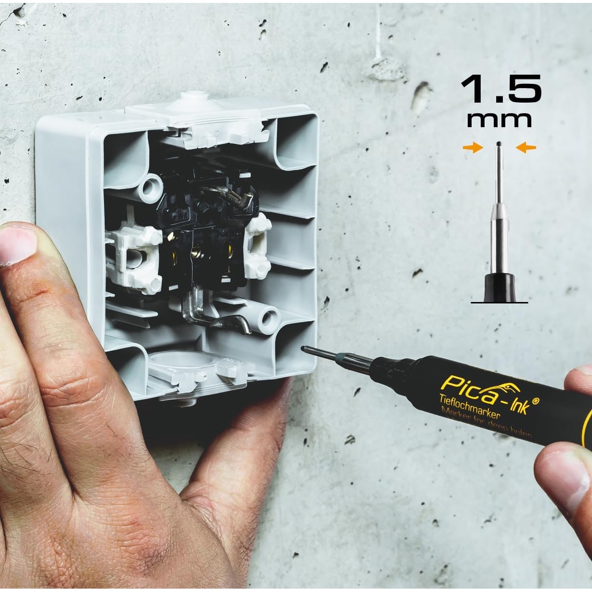 Pica Dry 150/46 deep hole marker placing a mark inside an electrical box opening on a wall during rough-in work