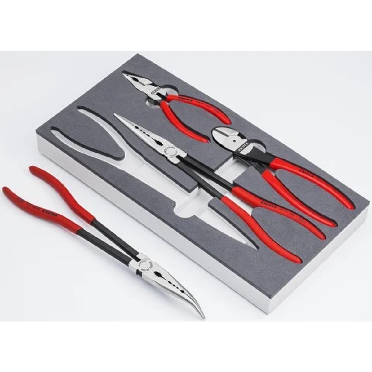 Knipex 00 20 01 V16 4 Pc Automotive Pliers Set in Foam Tray arranged in a foam insert on a workbench with one long-reach plier removed for automotive service access