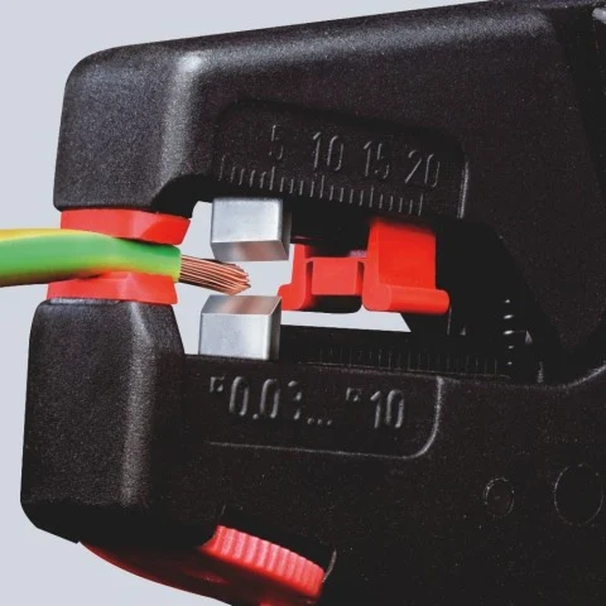 Knipex 12 40 200 Self-Adjusting Wire Stripper stripping insulated electrical wire during conductor prep for electrical installation