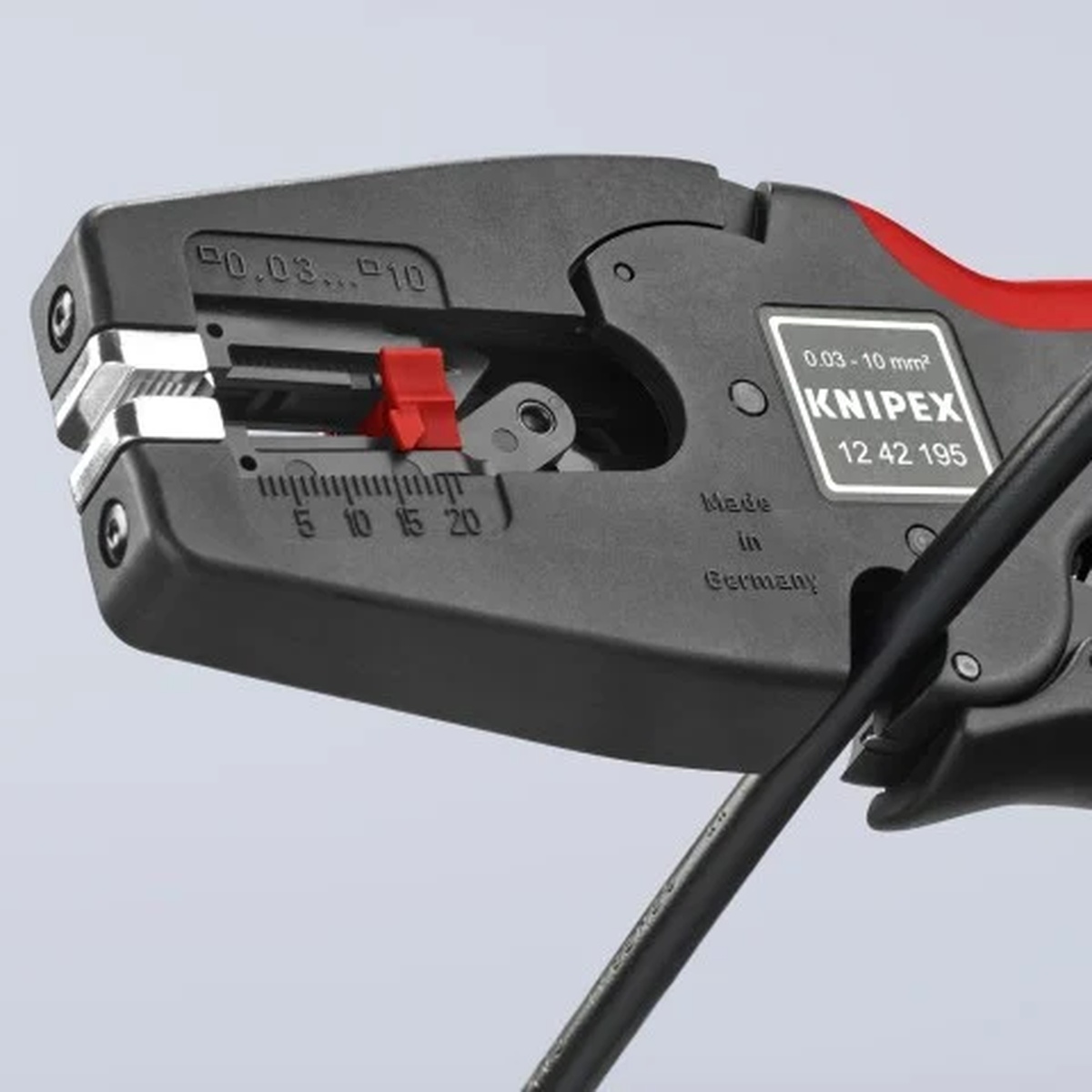 Knipex 12 42 195 Automatic Wire Stripper 8-32 AWG gripping insulated wire in a close-up electrical service setup