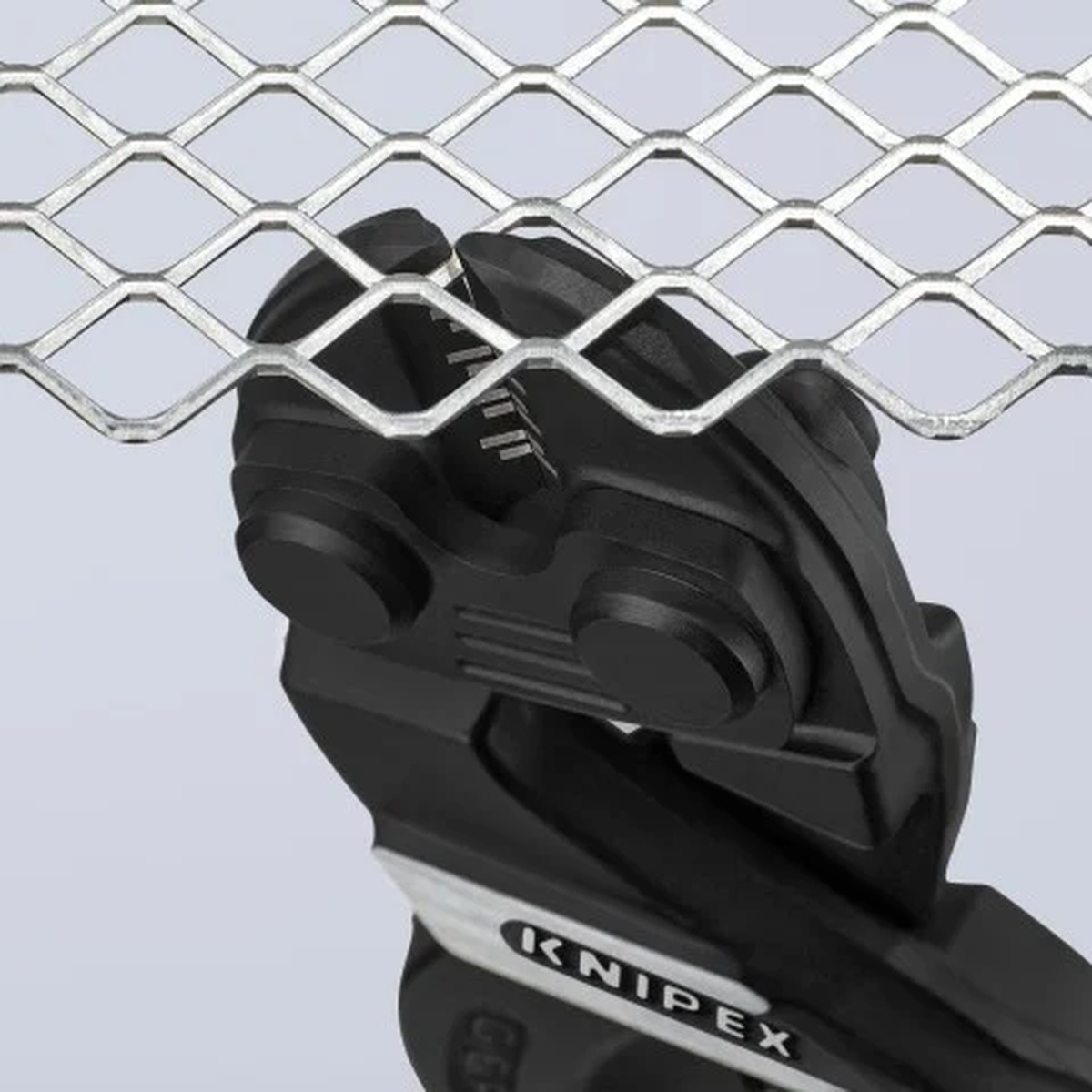 Knipex 71 01 160 CoBolt S Compact Bolt Cutters close-up of cutting head working on wire mesh for fencing and wire pulling tasks
