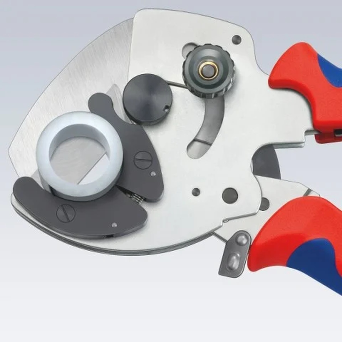 Knipex 90 25 40 PVC Pipe Cutter positioned on composite or plastic pipe for a straight cut during installation work