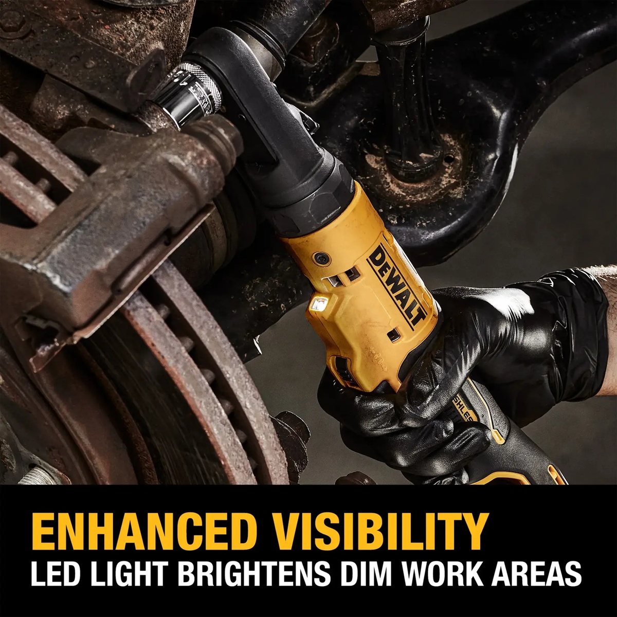 DeWALT DCF500B 12V MAX brushless sealed head ratchet using LED light to reach a fastener in a dim automotive brake and suspension work area