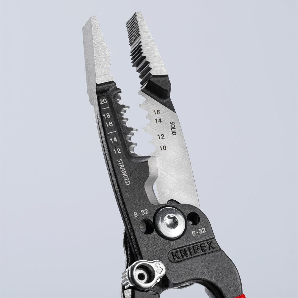 Knipex 13 71 8 SBA forged wire stripper close-up showing 10 to 20 AWG stripping holes and serrated jaws for electrical wire work in a shop or jobsite setting