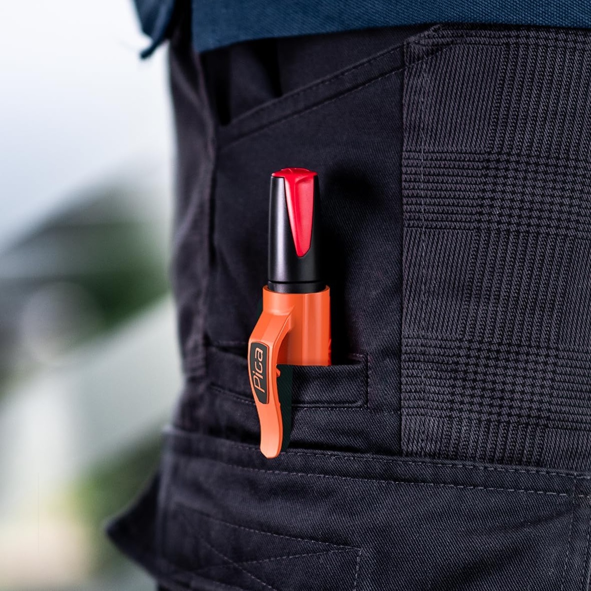 Pica Visor Permanent Industrial Marker clipped into workwear pocket for quick one-handed access on an active jobsite