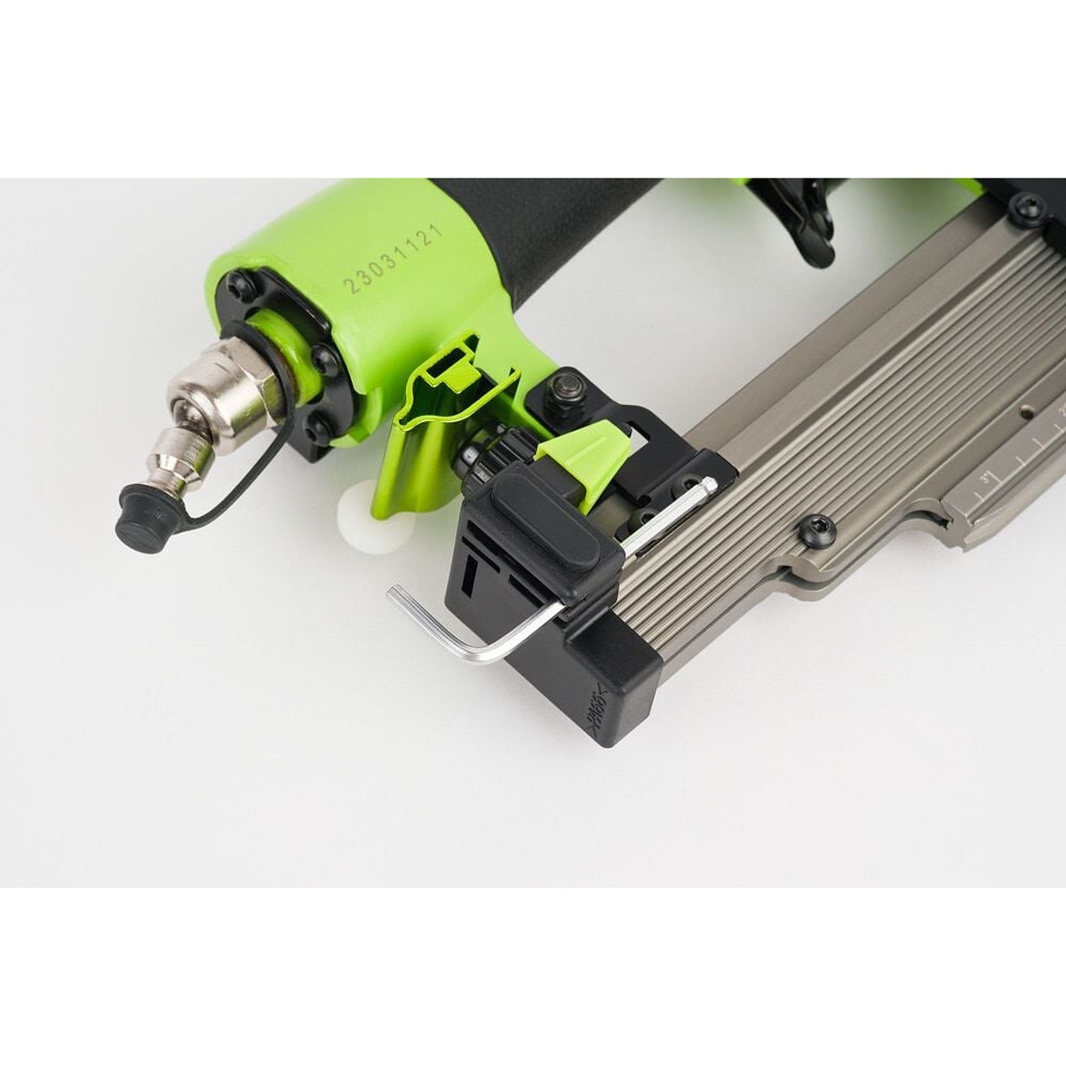 Grex P635L 23 Gauge 1-3/8 in. Headless Pinner with Lockout showing the self-adjusting magazine and loading area for quick pin changes in a woodworking shop setup