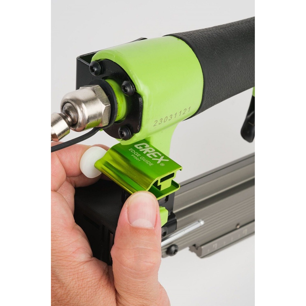 Grex P635L 23 Gauge 1-3/8 in. Headless Pinner with Lockout using the adjustable edge guide for accurate repeated pin placement on trim and cabinet parts