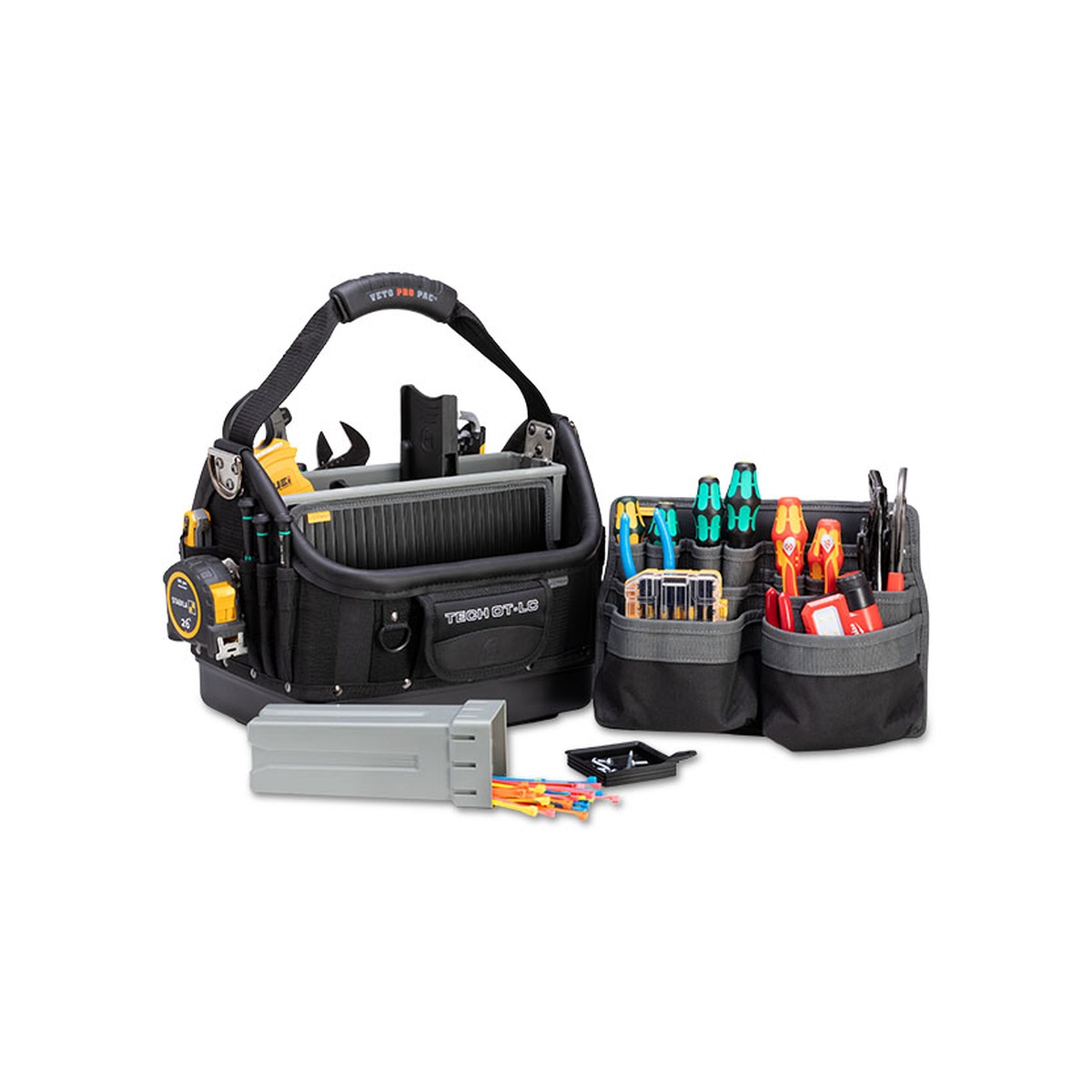 Veto Pro Pac TECH OT-LC BLACKOUT Large Open Top Technician's Tool Bag with removable pocket panels, insert box, and hand tools arranged for electrical and service work on a clean jobsite setup