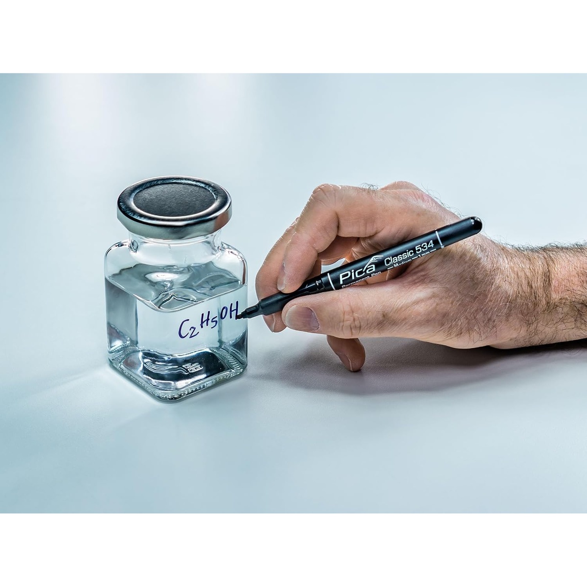 Pica Dry 533/46/SB Classic 533 Fine Round Tip Permanent Marker labeling a glass container for shop or lab organization