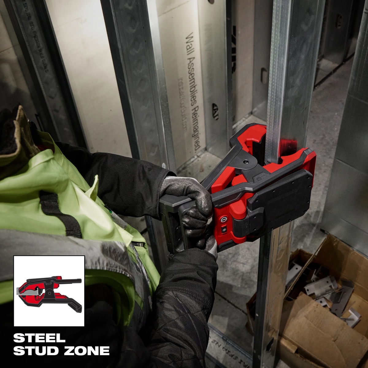 Milwaukee M18 ROVER Clamping Flood Light attached to steel stud framing during interior construction work
